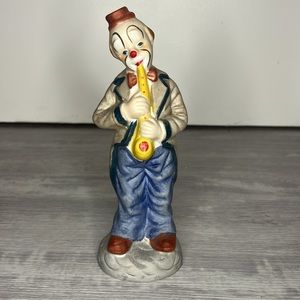 Porcelain enesco clown playing saxophone figurine
